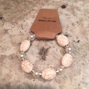 Off White Bracelet With Pearl Colored Beads